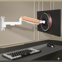 FlowArm Wall Mount in white — premium gas-spring monitor arm mounted on wall with clean minimal setup